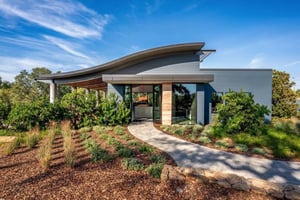 View entryway with sidewalk at winery tasting room exterior with Pura Lumen in New York Grey  Casino Mine Ranch Winery Pura NFC by Trespa Lumen New York Grey Photo Courtesy of @paulkozal.com