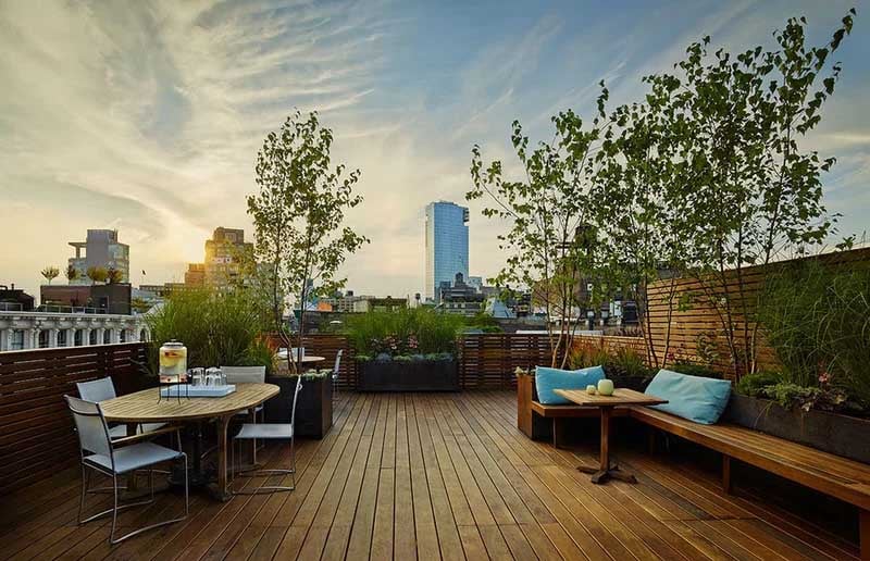 Ipe wood rooftop deck, built in benches, planters and privacy screen photo courtesy The Organic Gardener tognyc.com